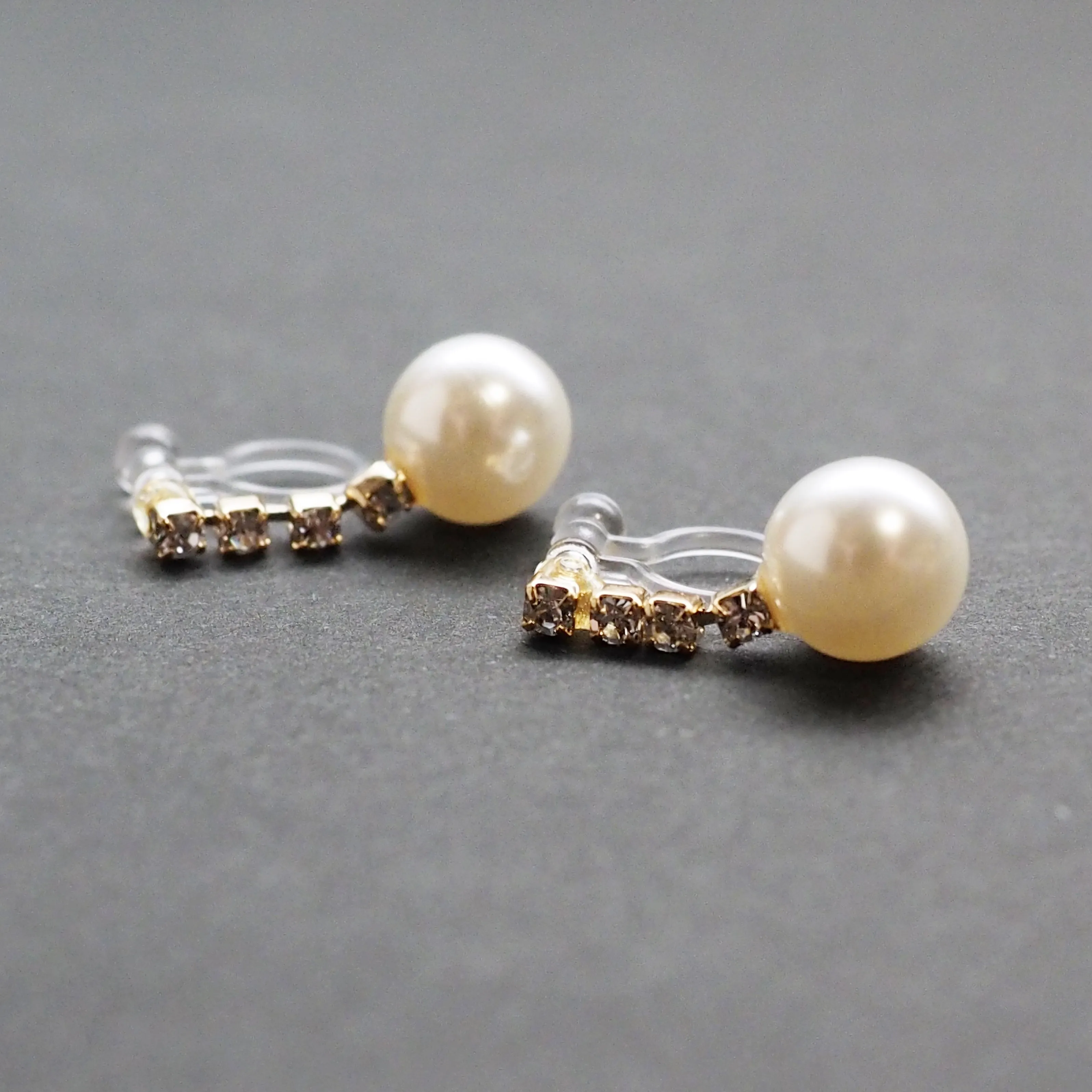 Dangle White Pearl & Crystal Invisible Clip On Earrings (Gold tone)